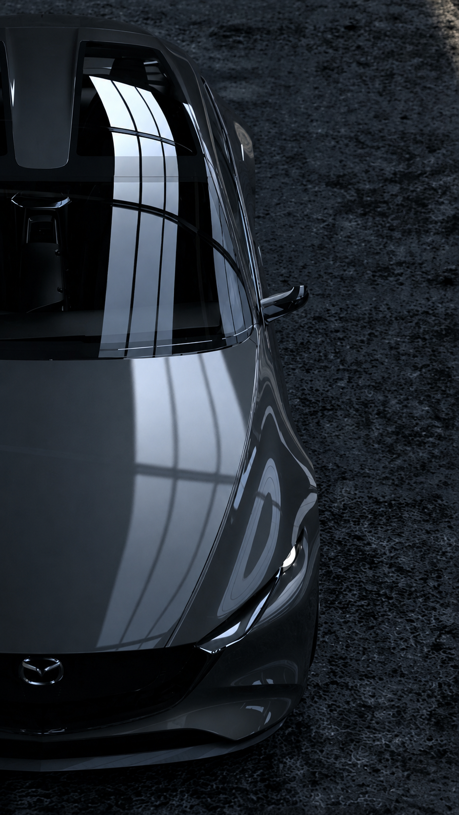 Windshield and vehicle seen from above in a dark studio environment
